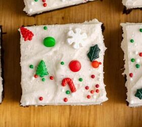 pretzel christmas treats, Peppermint Brownies with frosting and sprinkles on a cutting board