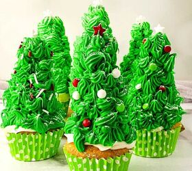 easy christmas tree cupcakes to brighten holidays, Christmas tree cupcakes decorated with bright green frosting white snowflake toppers red and white sprinkles and sugar dusting arranged in green polka dot liners