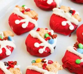 easy christmas tree cupcakes to brighten holidays, Red Santa s toy bag oreos topped with mini teddy bear cookies colorful candies and white icing details arranged neatly on a white platter