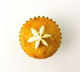 easy christmas tree cupcakes to brighten holidays, Vanilla cupcake topped with a small white buttercream star piped in the center ready for frosting