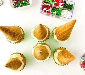 easy christmas tree cupcakes to brighten holidays, Six cupcakes topped with inverted waffle cones to form the base of Christmas tree cupcake decorations