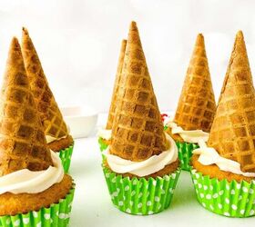 easy christmas tree cupcakes to brighten holidays, Side view of cupcakes with inverted waffle cones set on top of white frosting creating the shape of a Christmas tree base