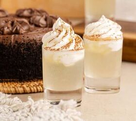 chocolate cake shot, Chocolate Cake Shot in Shot Glasses and Garnished with Whipped Cream and Cocoa Powder with Chocolate Cake in Background