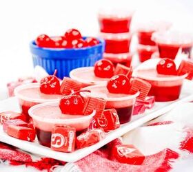 cherry starburst jello shots, a plate of cherry starburst jello shots garnished with a marachino cherry