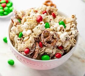 christmas crunch recipe easy holiday snack mix, A bowl full of christmas crunch with festive sprinkles and red and green M and M s
