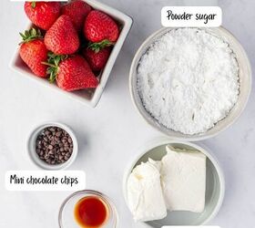 strawberry santas easy no bake christmas dessert, Overhead shot of festive strawberry santas ingredients arranged on a white background perfect healthy Christmas treat for kids