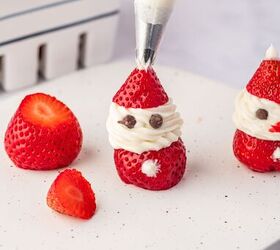 strawberry santas easy no bake christmas dessert, Close up showing detail of strawberry santa cream cheese frosting highlighting the cute faces and bright red berries