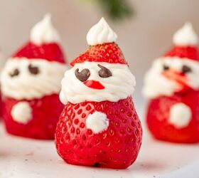 strawberry santas easy no bake christmas dessert, Close up showing detail of strawberry santa cream cheese frosting highlighting the cute faces and bright red berries