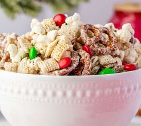 strawberry santas easy no bake christmas dessert, Festive bowl of Christmas Crunch mix surrounded by ornaments and candy canes ideal for holiday parties and gift ideas