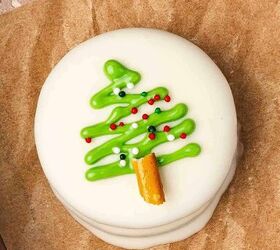 easy no bake white chocolate covered oreos 5 ingredient christmas tre, Decorating Oreos with pretzel trunks Christmas sprinkles and edible glitter while green drizzle is wet