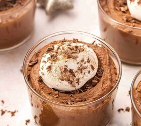 best 5 ingredient chocolate mousse to make at home, Chocolate mousse cups in mini glassware with whipped cream and cocoa dusting