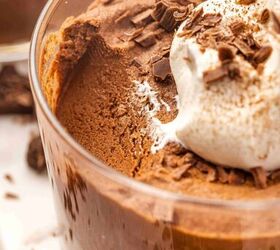 best 5 ingredient chocolate mousse to make at home, Close up of airy chocolate mousse topped with whipped cream in a clear glass