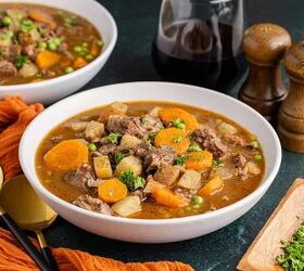 beef stew crockpot, Slow Cooker Beef Stew in a bowl garnished with parsley with another bowl in the back
