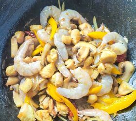 easy and delicious chicken and shrimp stir fry recipe, Raw shrimp added into the wok with chicken mushrooms and bell pepper