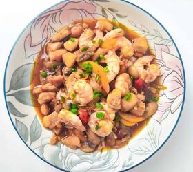 easy and delicious chicken and shrimp stir fry recipe, Top view of shrimp and chicken stir fry with mushrooms and peppers in a decorative bowl