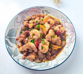 easy and delicious chicken and shrimp stir fry recipe, Shrimp and chicken stir fry plated in a floral bowl on a bright white background with garnish decor