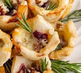 cranberry brie bites, Cranberry Brie Bites Stacked and Served on a Plate and Garnished with Fresh Rosemary Sprigs