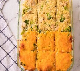 easy chicken broccoli rice casserole family favorite, Golden brown cheesy chicken broccoli rice casserole baked and cut into squares for serving
