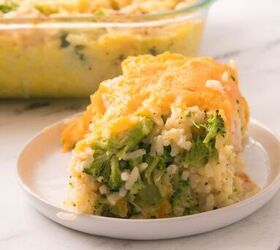 easy chicken broccoli rice casserole family favorite, Cheesy chicken broccoli rice casserole slice served on a white plate with melted cheddar on top