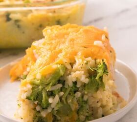 easy chicken broccoli rice casserole family favorite, Cheesy chicken broccoli rice casserole slice served on a white plate with melted cheddar on top