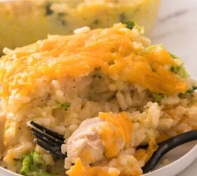 easy chicken broccoli rice casserole family favorite, Cheddar topped chicken broccoli rice casserole on a plate with a fork ready to enjoy
