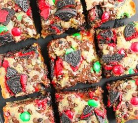 easy chicken broccoli rice casserole family favorite, Top down view of festive Christmas Oreo cookie bars cut into nine squares filled with red and green M M s crushed Oreo pieces and melted chocolate on a black serving board