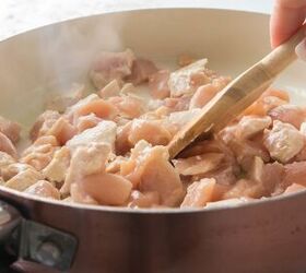 easy chicken broccoli rice casserole family favorite, Stirring diced chicken as it cooks in a skillet for easy chicken broccoli rice casserole