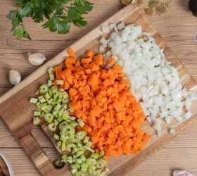 minestrone soup, Colorful diced carrots onions celery and garlic on wooden cutting board for traditional Minestrone soup