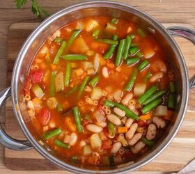minestrone soup, Delicious Italian vegetable soup with beans tomatoes and fresh herbs in a stainless steel pot