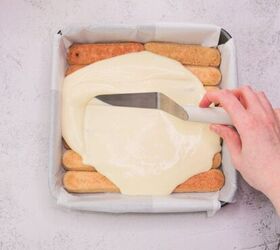tiramisu, Cream layer being spread over layered ladyfingers for Italian tiramisu dessert