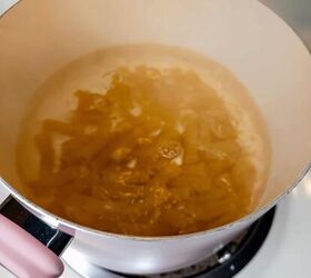 spicy rigatoni alla vodka, Noodles being prepared on a stove in a pot