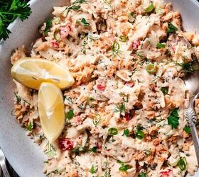 salmon pasta salad, Overhead photo of bowtie pasta salmon salad tossed in a creamy dressing with dill scallions capers and lemon wedges