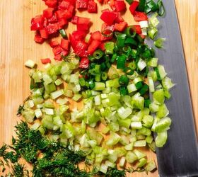 salmon pasta salad, Overhead view of chopped vegetables and herbs red bell peppers spring onions celery and dill