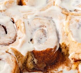 cinnamon rolls with fresh milled flour, Close up of iced cinnamon rolls one partially pulled out to show gooey swirled interior