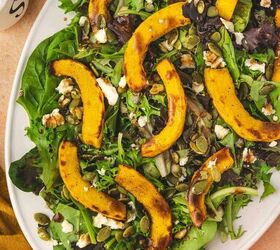 easy roasted pumpkin salad with feta balsamic vinaigrette, A bright cozy bowl of roasted pumpkin salad with spring greens feta and pumpkin seeds drizzled with balsamic vinaigrette