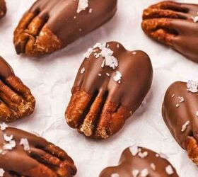 easy banana raspberry muffins with cake mix only 5 ingredients, Close up of glossy chocolate pecans on parchment paper ready to set