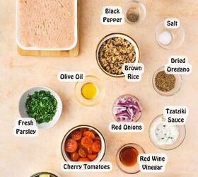 easy greek chicken and feta baked meatballs recipe gluten free, All ingredients for Greek chicken and feta meatballs arranged in bowls and on a wooden board including ground chicken crumbled feta breadcrumbs egg garlic herbs olive oil salt and pepper