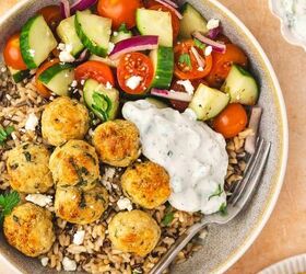 easy greek chicken and feta baked meatballs recipe gluten free, Overhead view of a bowl with brown rice cucumber tomato salad and baked chicken and feta meatballs drizzled with tzatziki