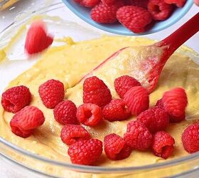 easy banana raspberry muffins with cake mix only 5 ingredients, Gently folding 1 cup of fresh or frozen raspberries into the banana cake batter