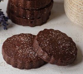 chocolate shortbread cookies easy shortbread cookie recipe, A stack of chocolate shortbread cookies with two laying in front of them