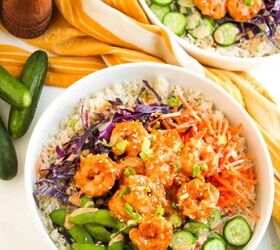 the best bang bang shrimp bowl ready in 30 minutes, Two bang bang shrimp bowls served with fresh vegetables on a white surface