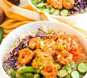 the best bang bang shrimp bowl ready in 30 minutes, Two bang bang shrimp bowls served with vegetables on a white surface