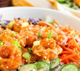the best bang bang shrimp bowl ready in 30 minutes, Bang bang shrimp bowl garnished with green onions and sesame seeds