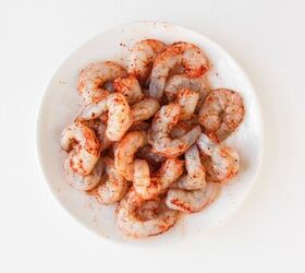 the best bang bang shrimp bowl ready in 30 minutes, Shrimp being coated in cornstarch before frying