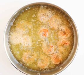 the best bang bang shrimp bowl ready in 30 minutes, Breaded shrimp frying in hot oil in a skillet