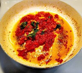 pasta al pomodoro, Hearty Italian tomato sauce simmering in a pot with fresh basil leaves and garlic