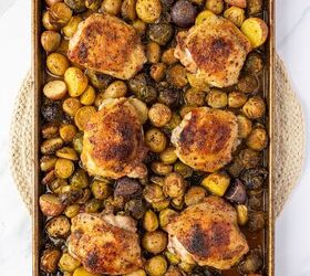 sheet pan chicken thighs, Cooked sheet pan chicken thighs on a sheet pan with potatoes and brussels sprouts