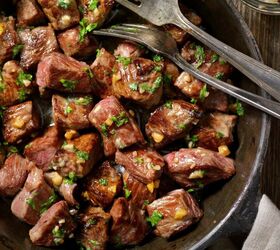 crockpot steak bites slow cooker steak bite recipe, Close up image of slow cooker steak bites with cutlery in the dish