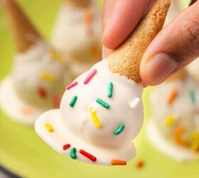 how to make ice cream cone cake pops easy dessert, Hand holding a melted ice cream cone cake pop dipped in white chocolate and sprinkles