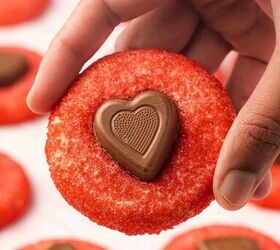 easy valentine s day heart cookies eggless sugar cookies recipe, Close up of a hand holding soft heart shaped sugar cookies with red sparkling sugar and chocolate heart centers
